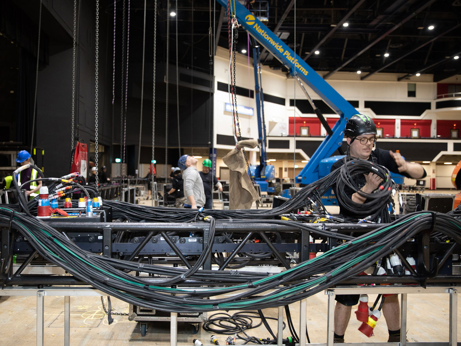 Rigger at work, on The 1975 UK Tour, Motorpoint Arena, Cardiff, UK